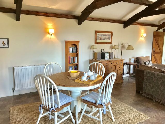 Honeysuckle Cottage dining area - holiday cottage for 2 in Bude with pool