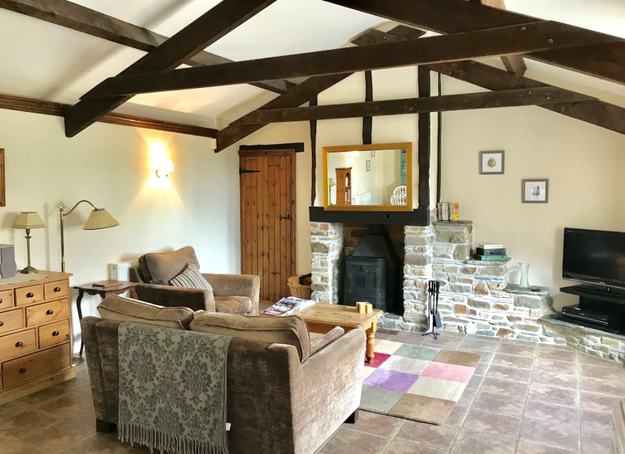 Honeysuckle Cottage Living Room with log burner - holiday cottage for 2 in Bude with pool
