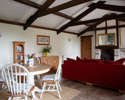 Honeysuckle Cottage Living Room with log burner - holiday cottage for 2 in Bude with pool